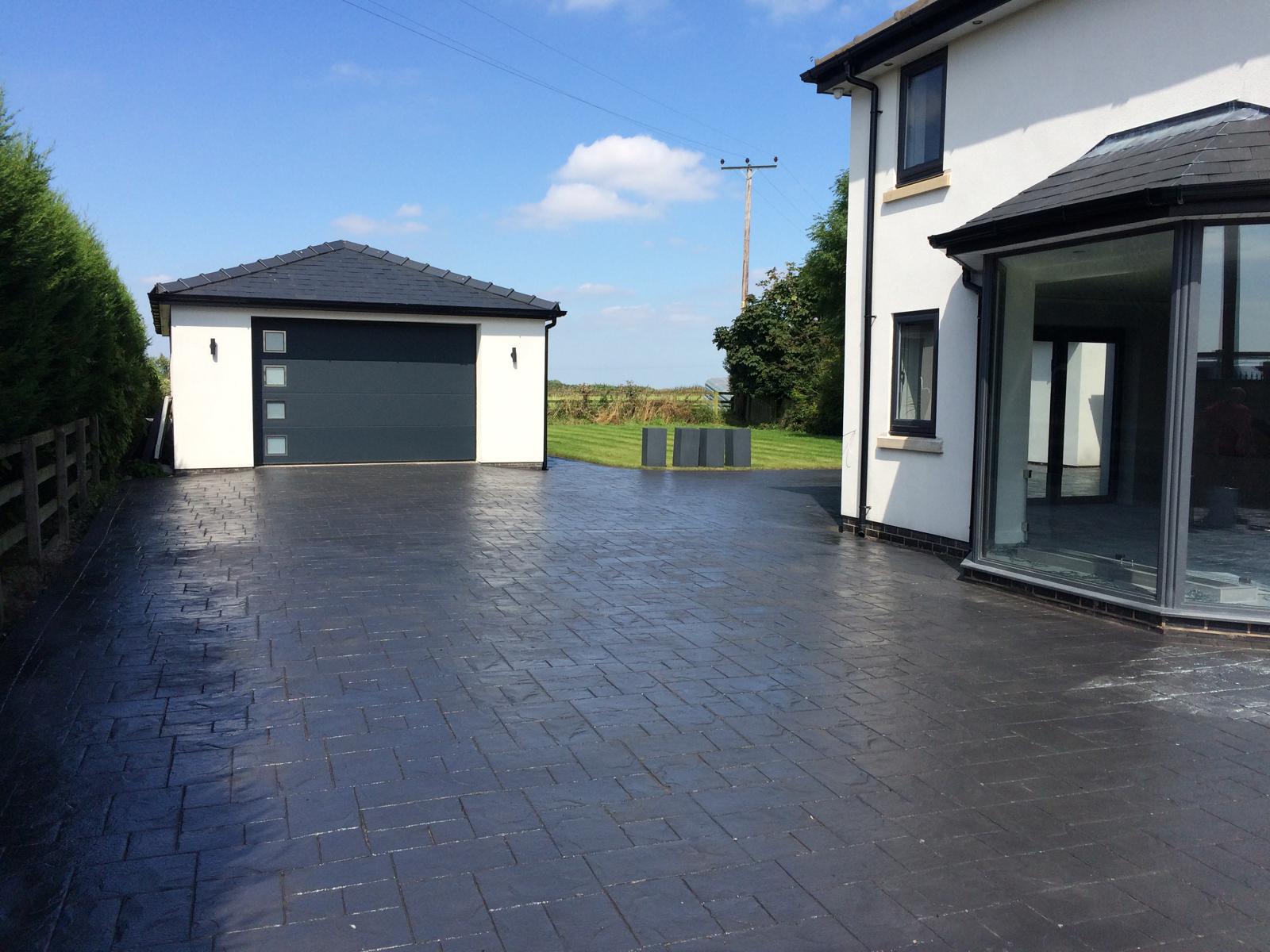 Charcoal imprinted concrete driveway installed in Warrington by Premier Driveways