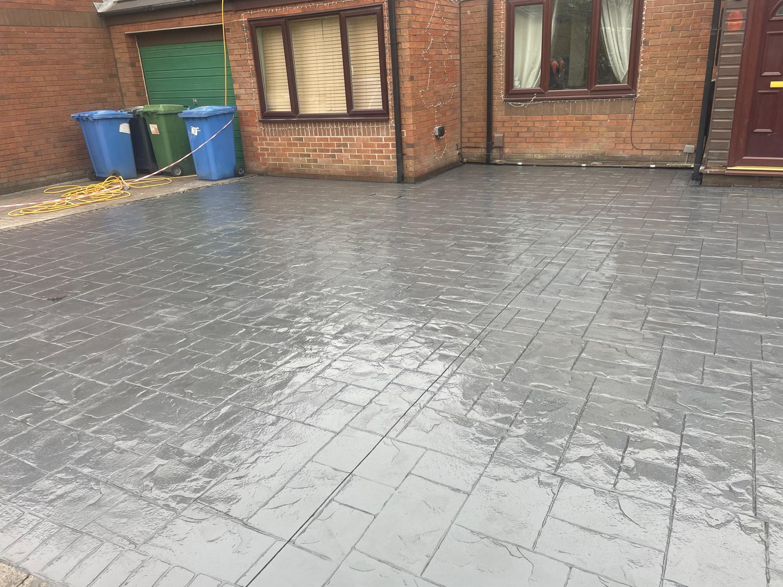 Light grey imprinted concrete driveway with contemporary side access, Warrington