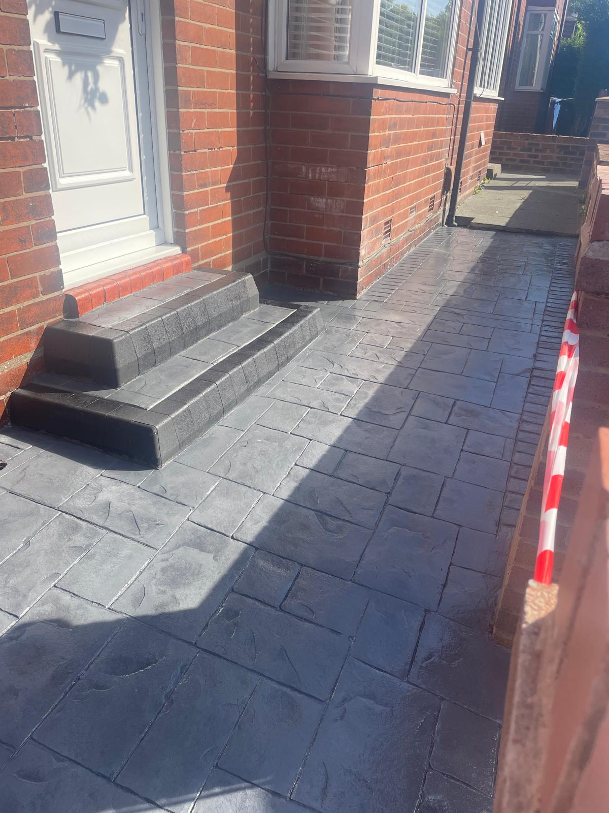 Imprinted concrete walkway and steps installed in Warrington